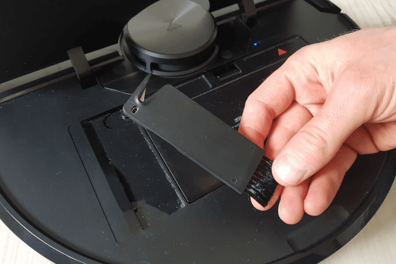 Under the Roborock S6’s cover is a small cleaning tool